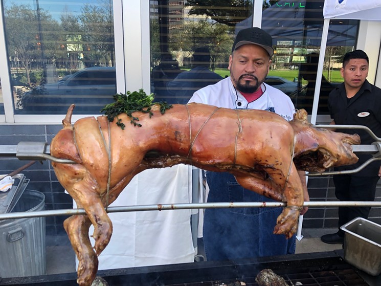 Ninfa's executive chef Alex Padilla roasts a pig. - PHOTO BY RACHAEL AUSTIN