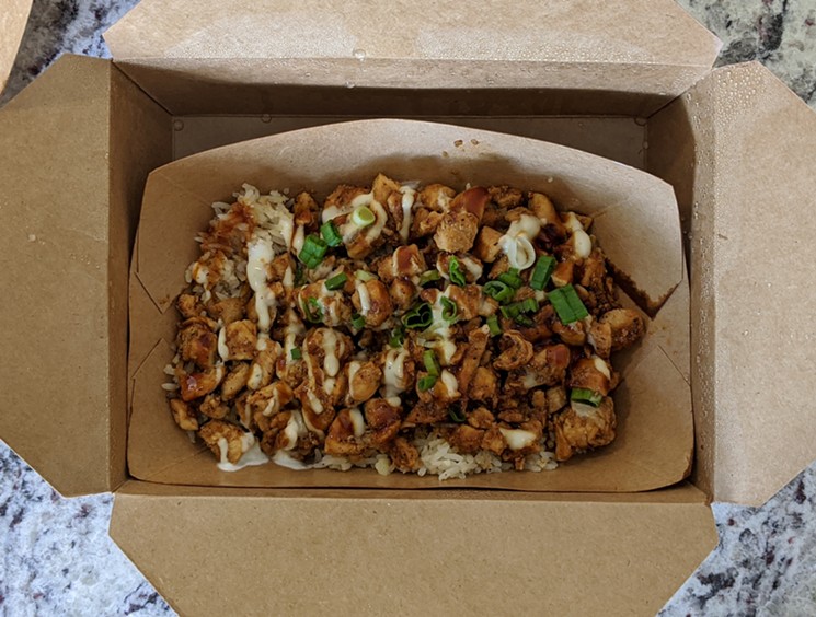 The classic, Sticky's Chicken Over Rice. - PHOTO BY CARLOS BRANDON