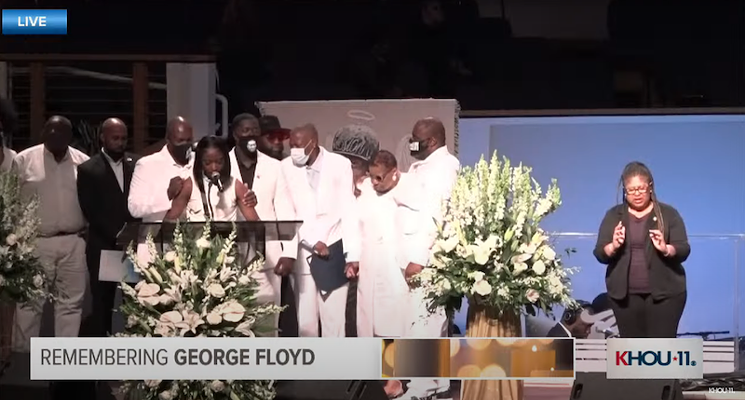Brooke Williams, George Floyd's niece, remembered her uncle for those in attendance, surrounded by other family members. - SCREENSHOT