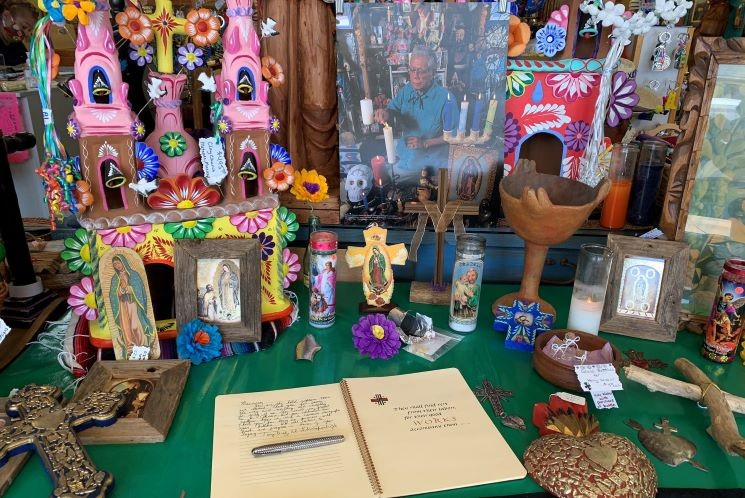 An ofrenda, or altar, to Ramirez was erected at his Heights gallery, with a book for visitors to pen tributes. - PHOTO BY TONY DIAZ @LIBROTRAFICANTE ON TWITTER