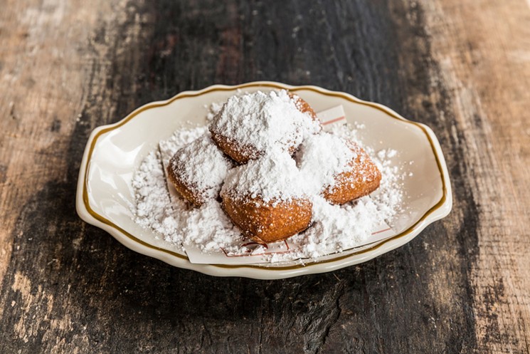 Wait till you get home before you eat the beignets. - PHOTO BY JULIE SOEFER