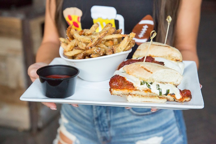 Have a sandwich and crispy fries watching sports at Bottled Blonde. - PHOTO BY BOTTLED BLONDE MARKETING STAFF