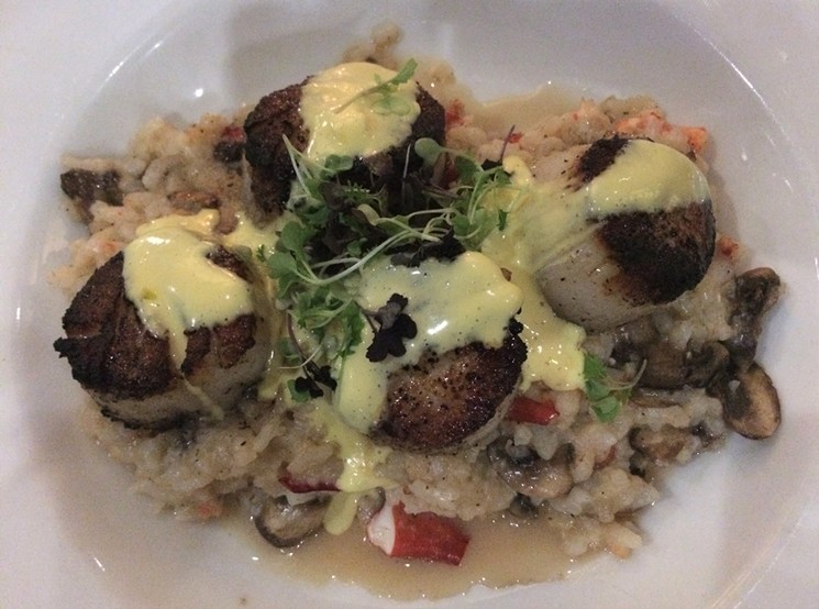Chunks of lobster and wild mushrooms lies underneath seared scallops. - PHOTO BY ALEX RYAN