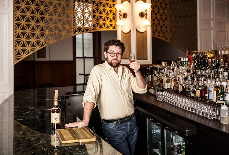 Justin Vann owning the bar at Public Services. - PHOTO BY JULIE SOEFER