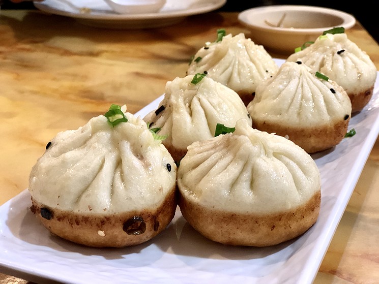 One Dragon Restaurant's Sheng Jian Bao (pan-fried pork soup dumplings). - PHOTO BY MAI PHAM.