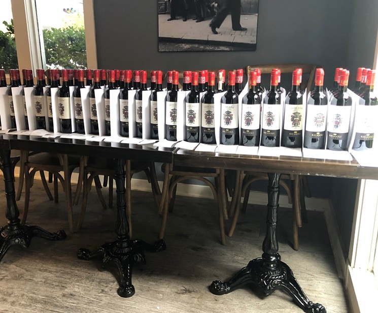 An army of wine awaits deployment to Houston homes. - PHOTO BY SHANON SCOTT