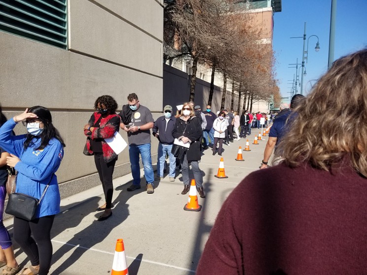 Houston area residents lined up Saturday outside Minute Maid Park for their coronavirus vaccine appointments. - PHOTO BY MARGARET DOWNING