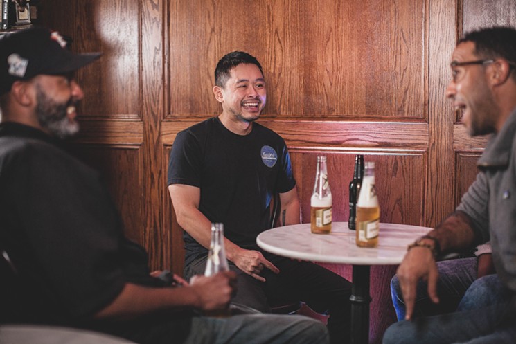 Lawrence Walker, Khang Hoang and Chris Williams  take a break for some laughs and beers. - PHOTO BY AYAAN AHSAN