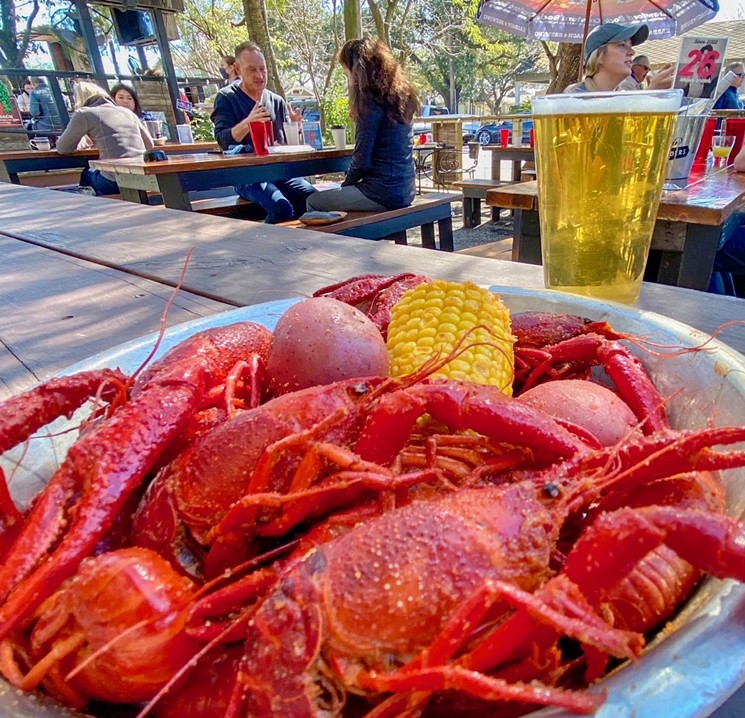 Life doesn't get much better than boiled crawfish and cold beer on a patio. - PHOTO BY FABIOLA VALENCIA