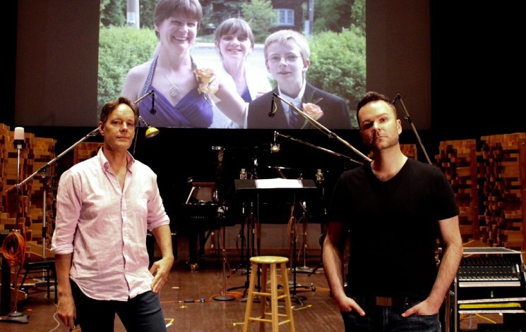 Composer Jake Heggie and baritone Joshua Hopkins on the scoring stage of Skywalker Sound with an image of Joshua’s sister Nathalie Warmerdam and her two children Valerie and Adrian (background). - PHOTO BY ZOE TARSHIS