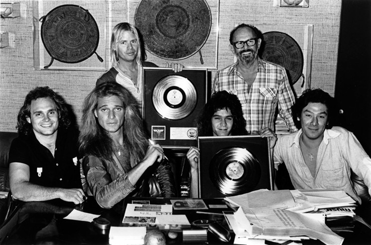 Producer Ted Templeman (back left, next to Mo Ostin) with Van Halen at an award presentation (from left: Michael Anthony, David Lee Roth, Eddie Van Halen, Alex Van Halen). - PHOTOGRAPHER UNKOWN/USED WITH PERMISSION OF HENRY HOLT