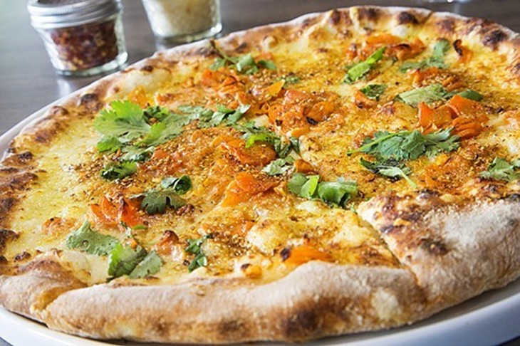 The Roasted Carrot Pizza at Weights + Measures is a brunch favorite. - PHOTO BY TROY FIELDS