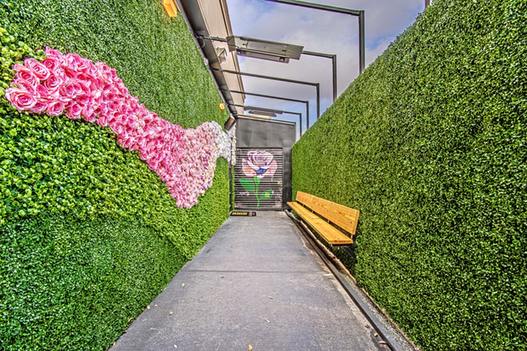The petite patio offers some greenery. - PHOTO BY VANESSA CHAVEZ/ REALTY EXPOSURE PHOTOGRAPHY
