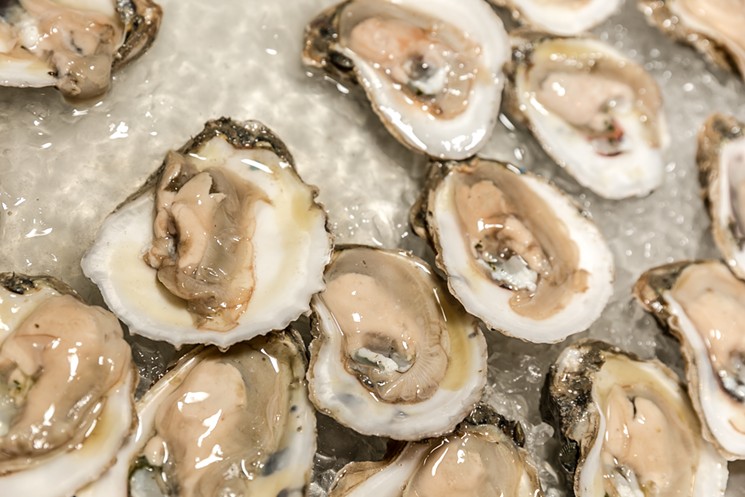 Julep's fifth annual Oyster Shucking Contest features fierce competitors and $1 oysters. - PHOTO BY EMILY JASCHKE