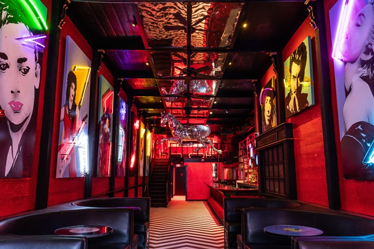 Neon lights and familiar faces line the walls at Cherry. - PHOTO BY MICHAEL ANTHONY