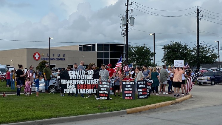 Protesters joined soon-to-be fired Houston Methodist employees to decry mandatory vaccinations. - PHOTO BY SCHAEFER EDWARDS