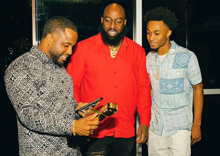 From left to right: Roderick Batson, Trae Tha Truth and Trae's eldest son Jared. - PHOTO BY TROIE GONZALES