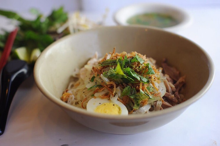 Pho ga kho is served dry with broth on the side. - PHOTO BY PHUONG V. NGUYEN