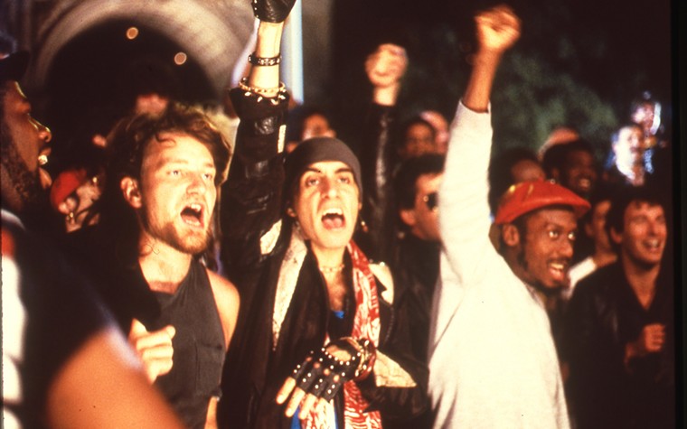 Van Zandt in between U2's Bono and reggae star Jimmy Cliff at the "Sun City" video shoot. Also visible is Run DMC's Jam Master Jay, Lou Reed and Bruce Springsteen. - PHOTO BY REUVEN KOPITCHINSKI/COURTESY OF HACHETTE BOOKS