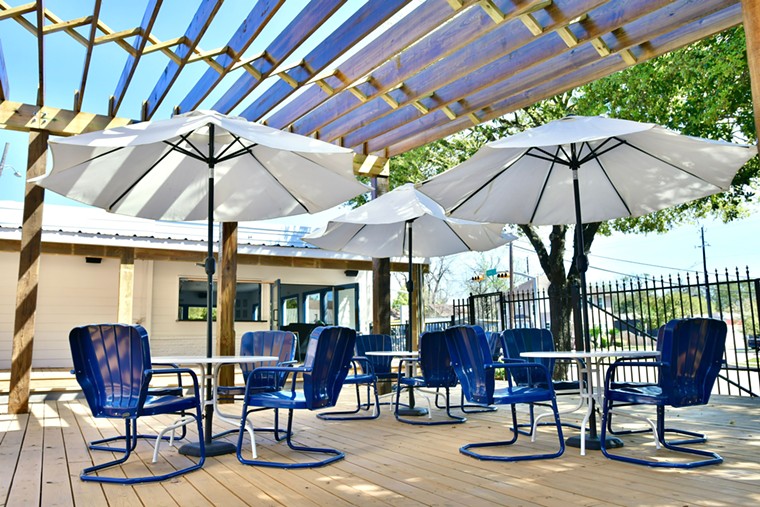A pergola lets in sunlight while the umbrellas offer some shade. - PHOTO BY ALEX MONTOYA