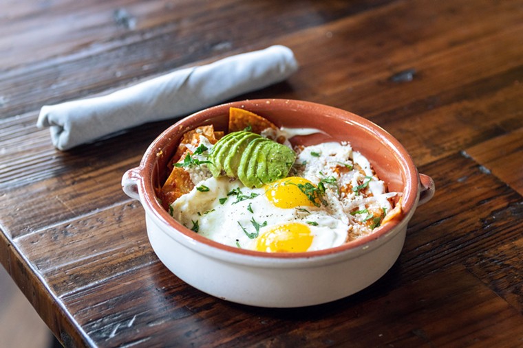 Chilaquiles get the Chivos treatment for brunch. - PHOTO BY DYLAN MCEWAN
