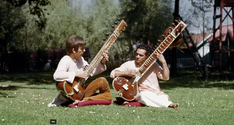 George Harrison taking a sitar lesson from Ravi Shankar. - SCREEN GRAB