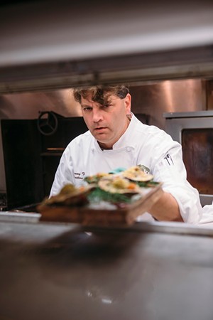 Chef Danny Trace hard at work in the Brennan's kitchen. - PHOTO BY TROY FIELDS