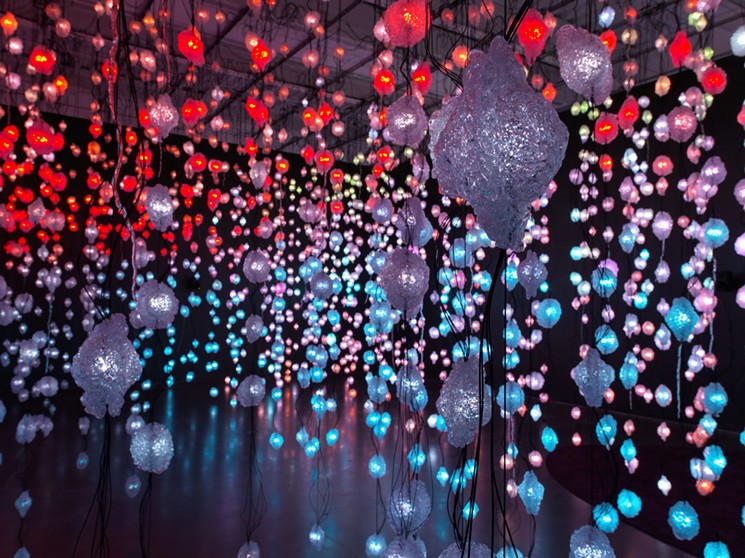 Lighting designer Kaori Kuwabara collaborated with Rist in creating Pixel Forest Transformer, where thousands of hanging LED lights are controlled by a video signal, with lights sometimes shifting in a staccato rhythm and sometimes in waves of color. - PHOTO BY MARIS HUTCHINSON, EPW STUDIO, COURTESY OF NEW MUSEUM