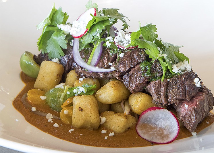 A new, meatier dish at Peska: hanger steak with Mexican-inspired gnocchi and romesco. - PHOTO BY TROY FIELDS