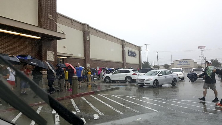 The line at Kroger on 11th in the Heights on Monday afternoon. - PHOTO BY BRIAN COOK