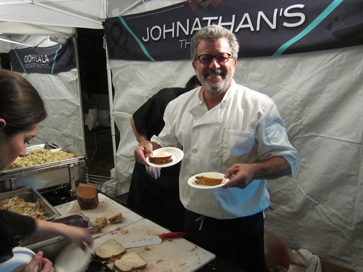 Proprietor Jonathan Levine of Jonathan's The Rub had one of the night's tastiest bites: A smoked turkey, stuffing and cranberry sandwich. - PHOTO BY MAI PHAM