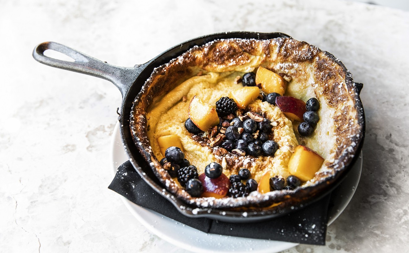 Lemon ricotta Dutch baby pancakes with pecans, berries and maple syrup make for a choice lazy day brunch.