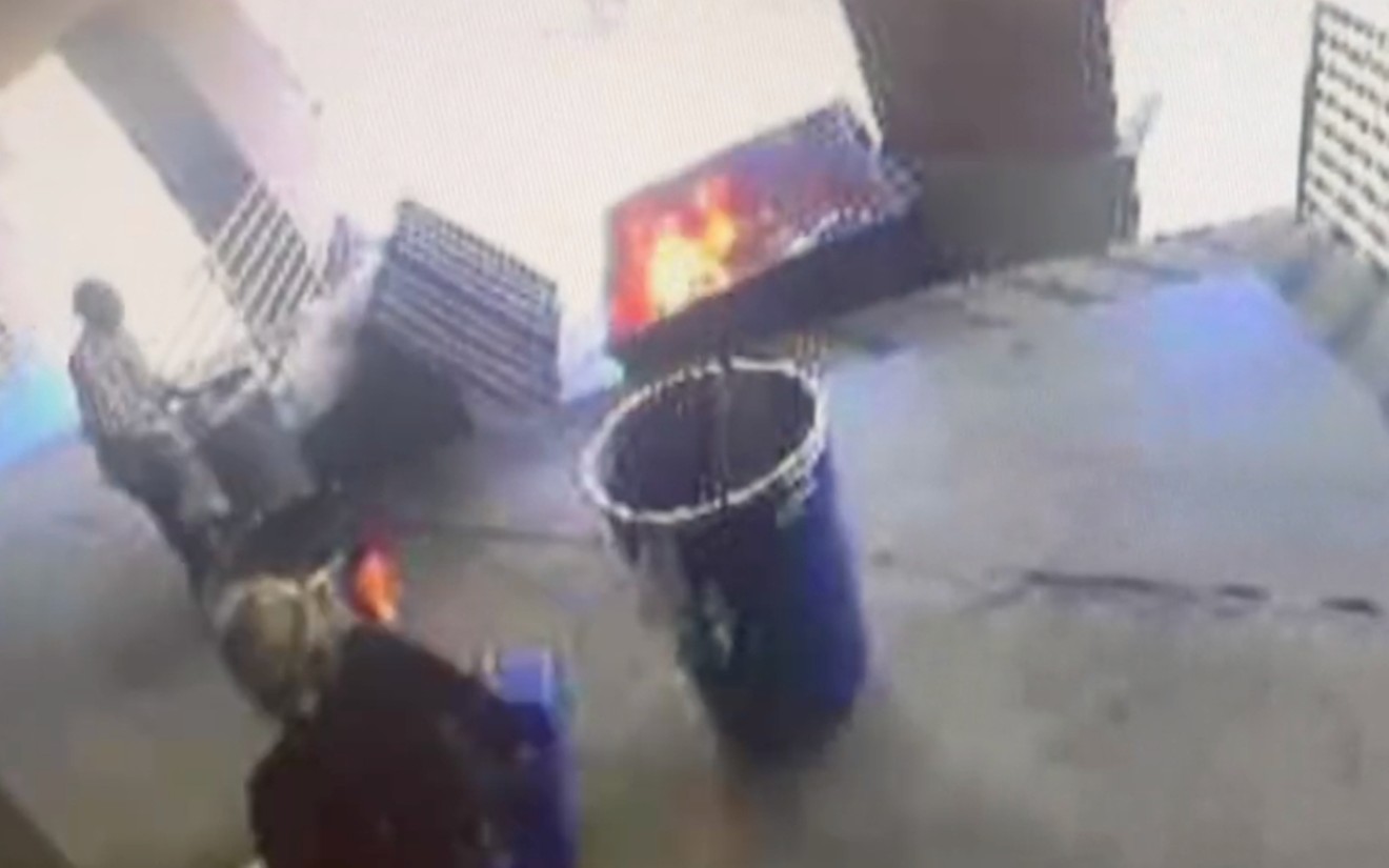 Surveillance video outside of the Office of the Texas Attorney General Ken Paxton caught two individuals located near a dumpster fire Wednesday evening.