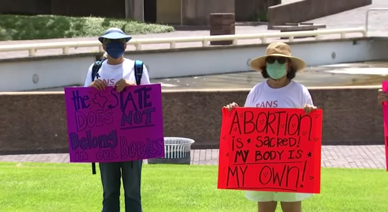 Pro-choice advocates protested in Houston Wednesday over Texas' new restrictive abortion law.