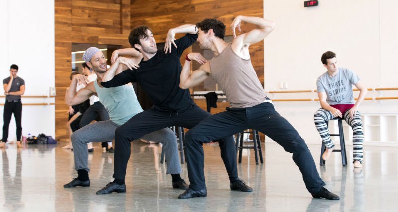 First Soloist Oliver Halkowich, Principals Connor Walsh and Charles-Louis Yoshiyama with artists of the Houston Ballet in Jerome Robbins' Fancy Free.