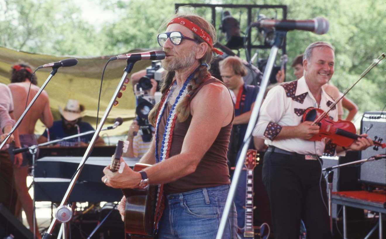 Willie Nelson performs at the 1979 Picnic at his Pedernales Country Club alongside famed fiddler Johnny Gimble.